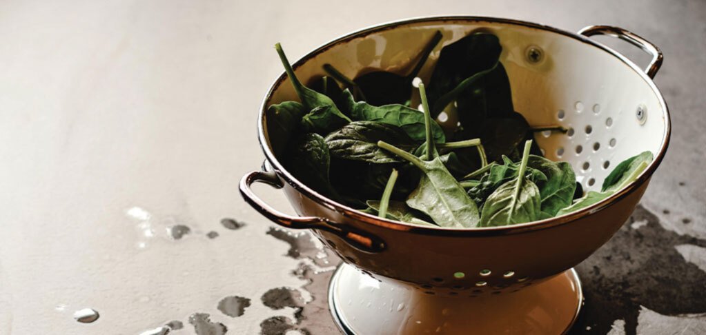 Spinach in a water drainer